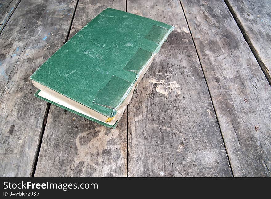 Old book cover on old table