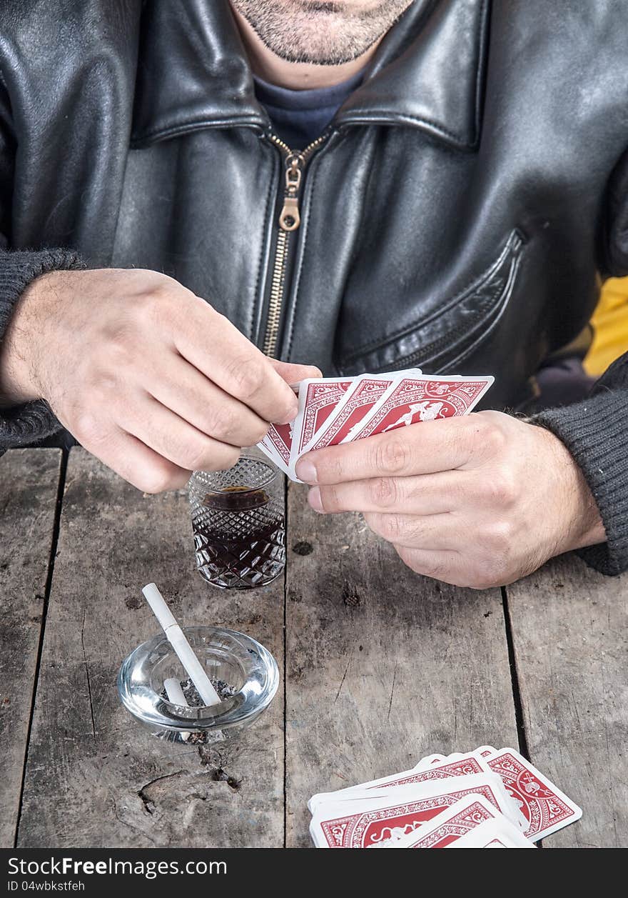 Poker player looking at his hand