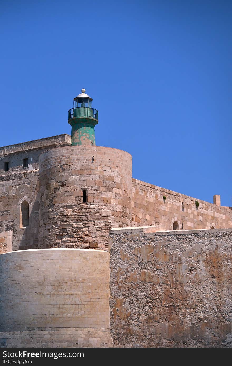 View on lighthouse of the Ortigia island - old city of Siracusa, Italy. View on lighthouse of the Ortigia island - old city of Siracusa, Italy