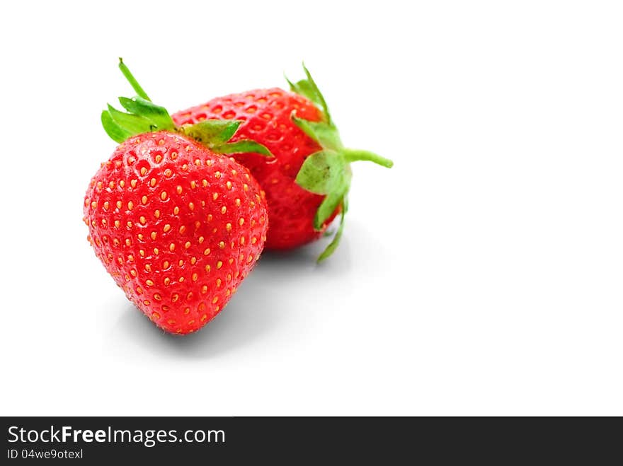 Two Strawberries  On A White Background