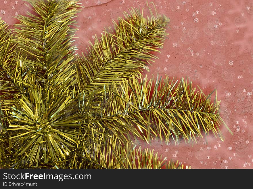 Golden Christmas star decoration on the dark pink background