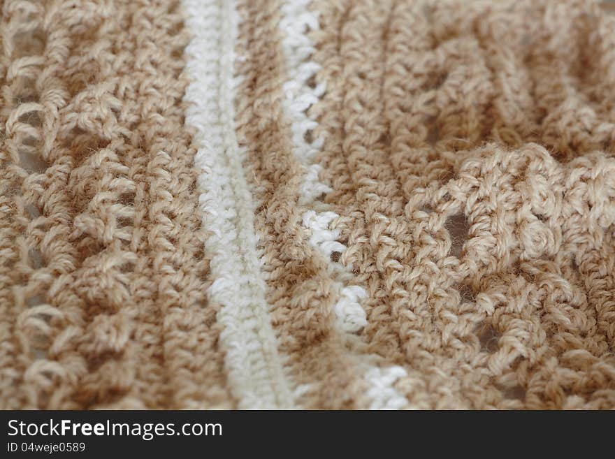 White and beige knitted whool texture background. White and beige knitted whool texture background