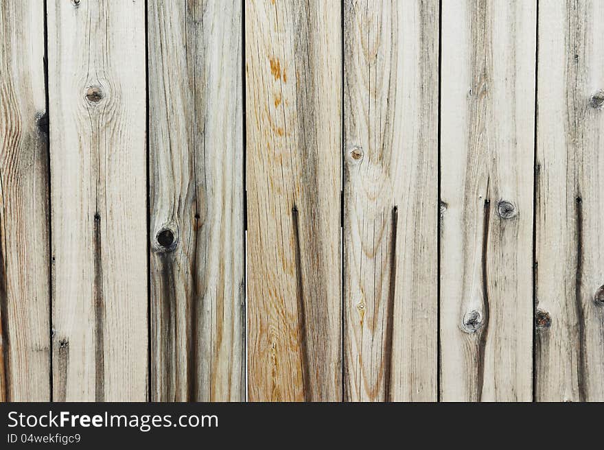 Close up on an old and run-down wooden fence. Close up on an old and run-down wooden fence.