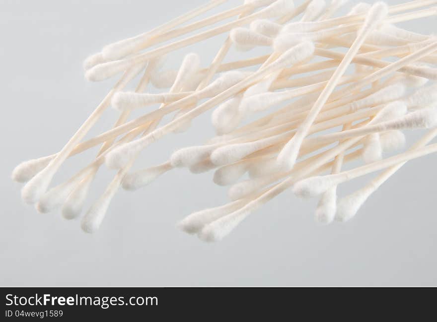 Bunch of q-tips in jar and table. Bunch of q-tips in jar and table