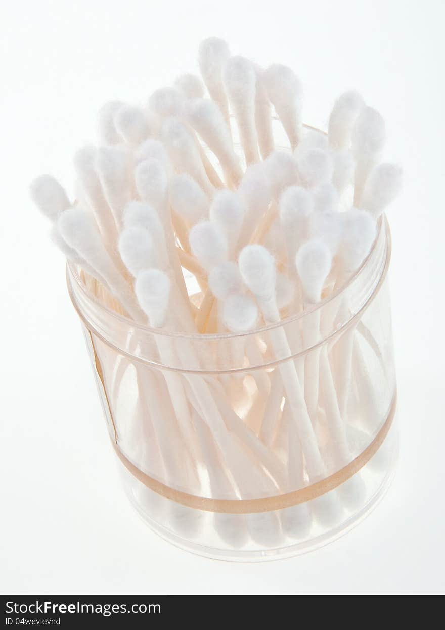 Bunch of q-tips in jar and table. Bunch of q-tips in jar and table