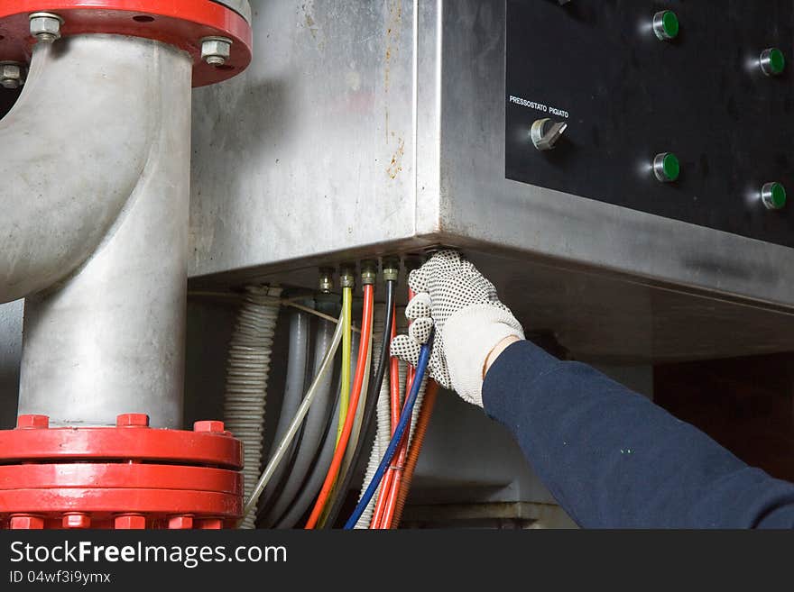 Repairman at work for a maintenance job in a site