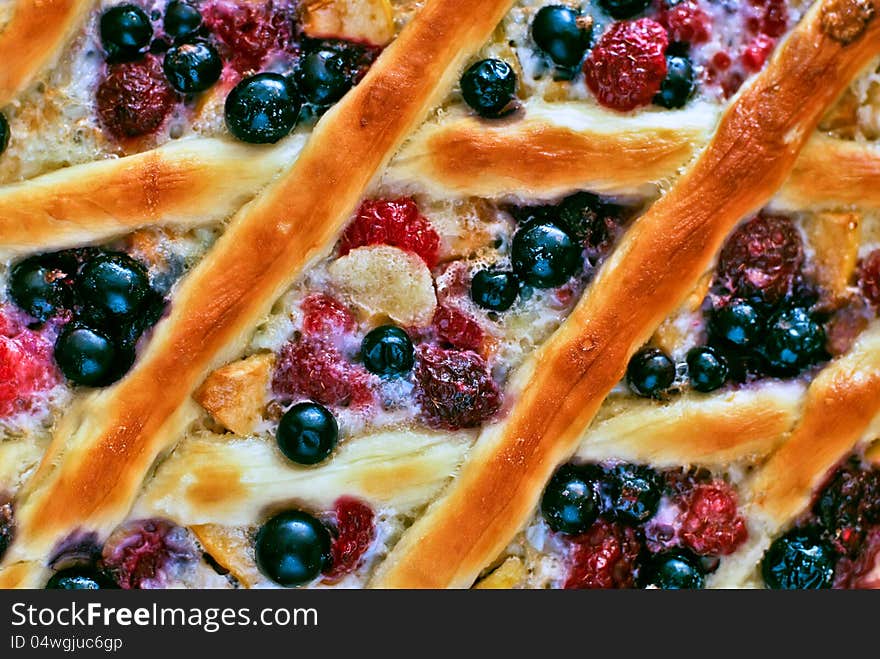 Open Weaving Sweet Pie with Apples, Currant and Raspberry Top View background. Open Weaving Sweet Pie with Apples, Currant and Raspberry Top View background