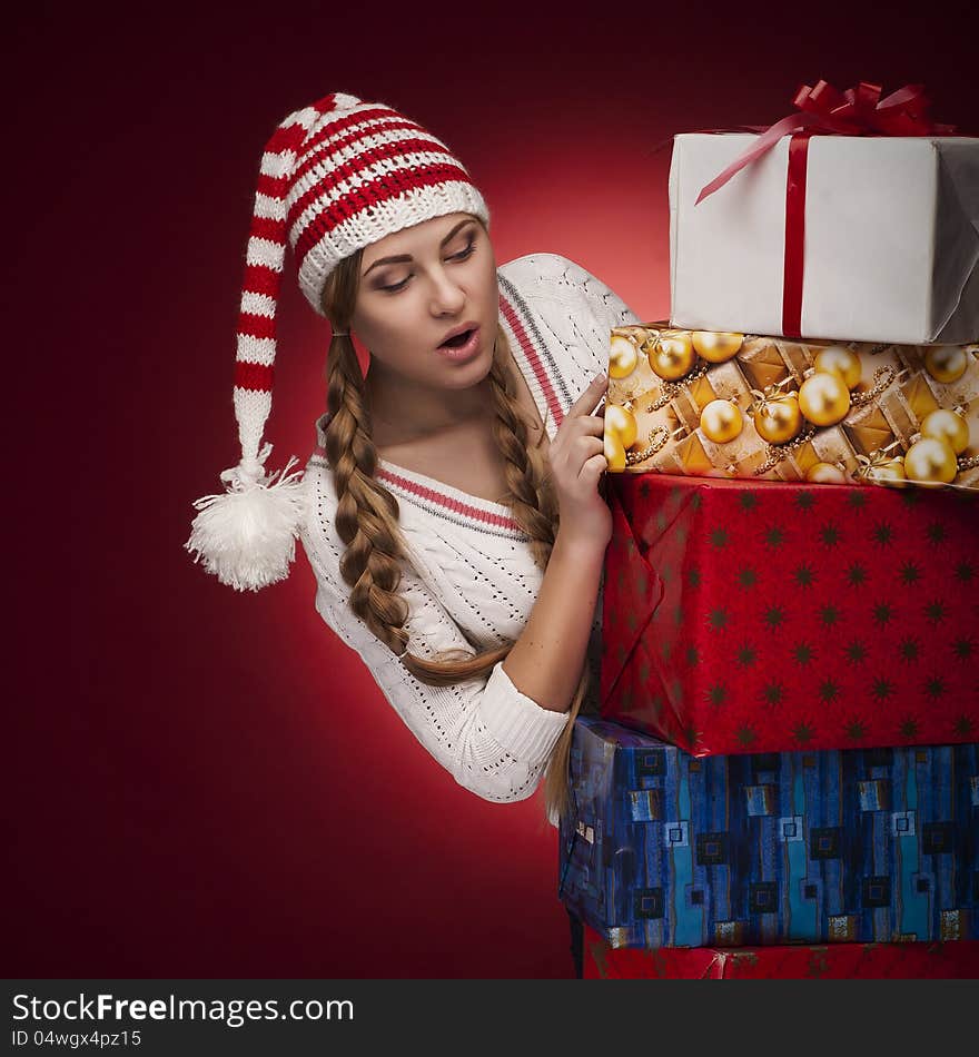 Women with Santa hat with presents isolated