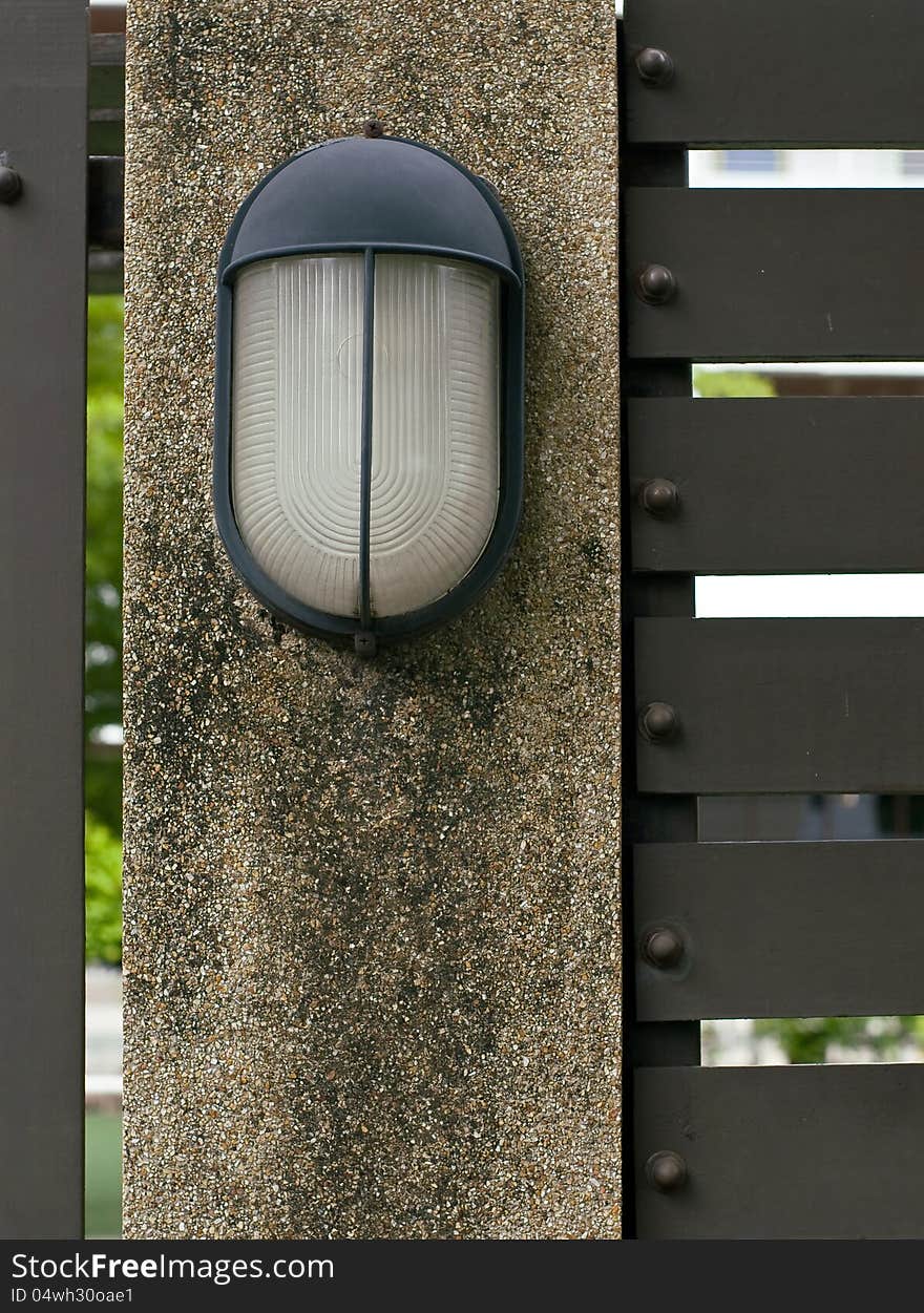 Lamp on fence of the garden