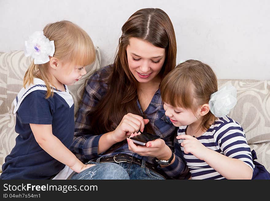 The three sisters with smartphones