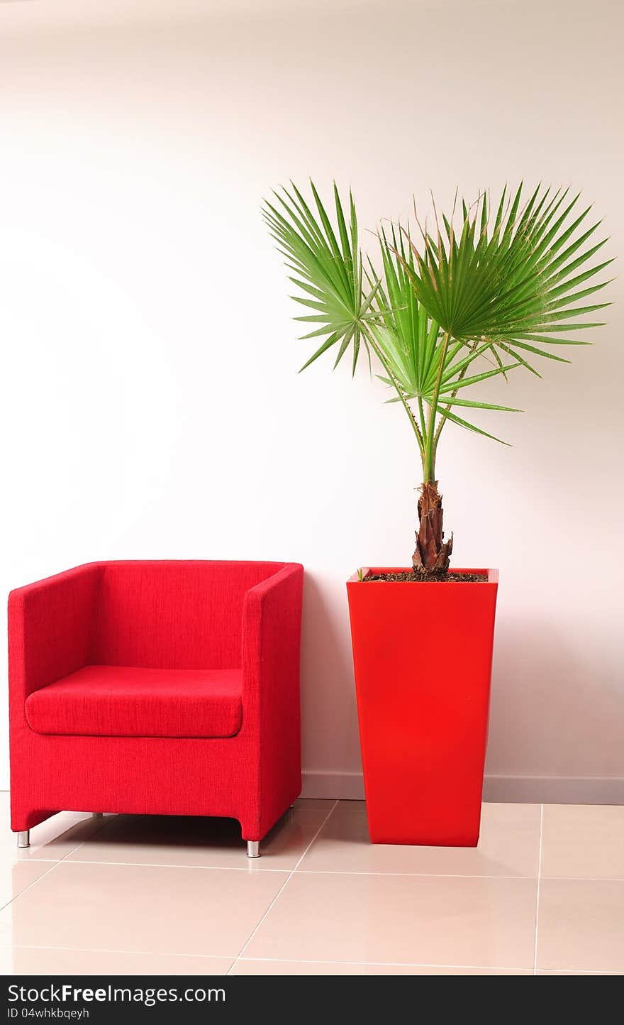 Modern red sofa on tiled floor. Modern red sofa on tiled floor.