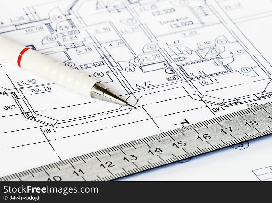 The drawing of house with a pencil and a ruler