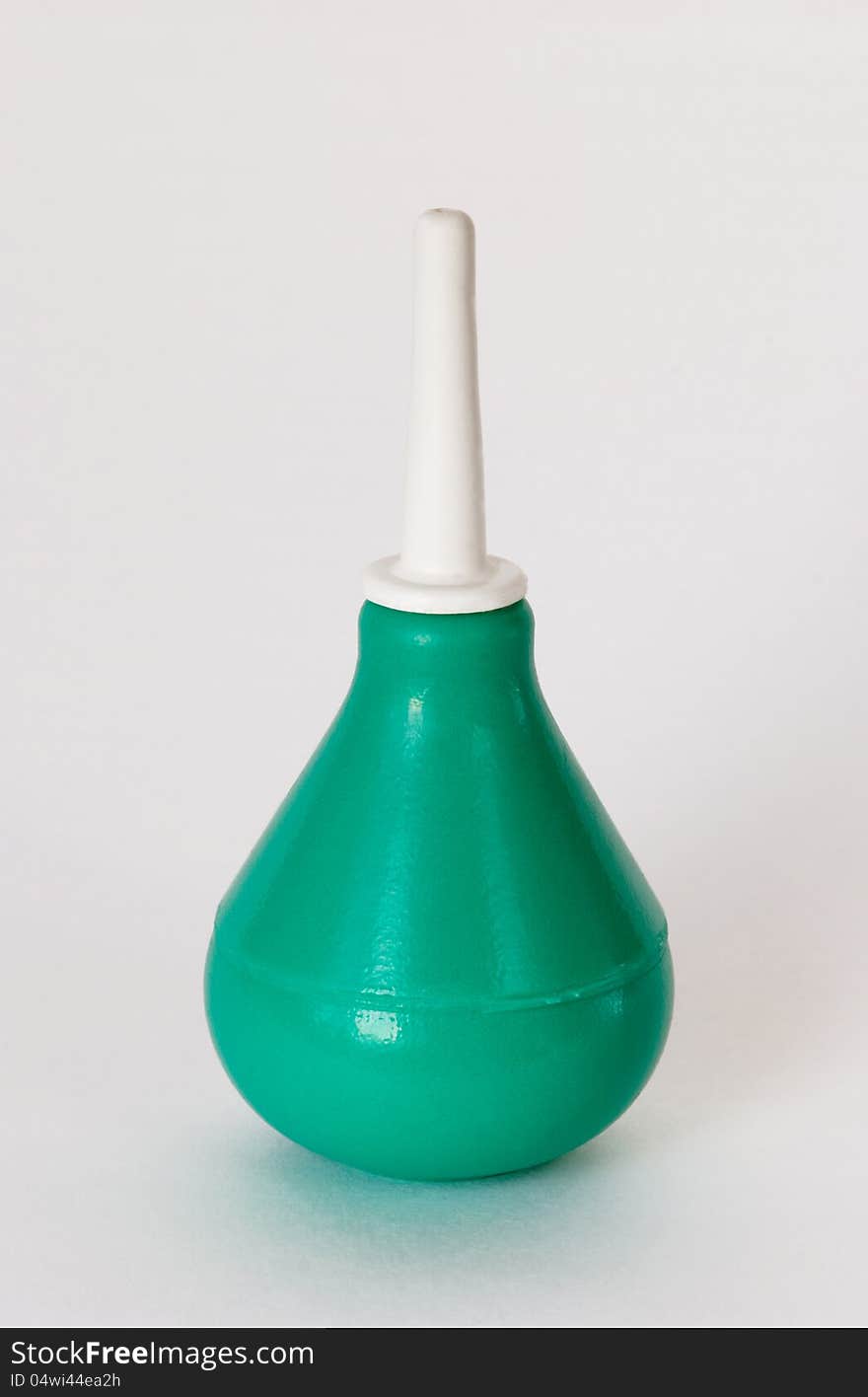 Green Syringe On White