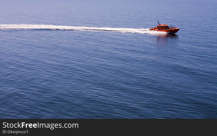 Red motorboat in the sea