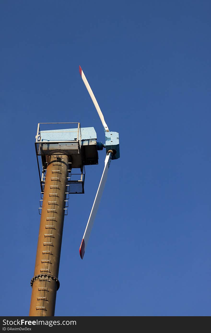 Modern windmill against blue sky