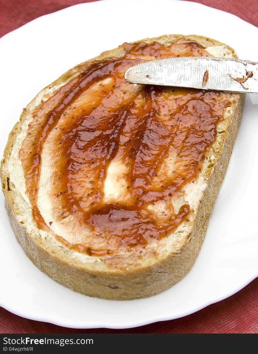 Closeup of bread with butter and strawberry jam. Closeup of bread with butter and strawberry jam