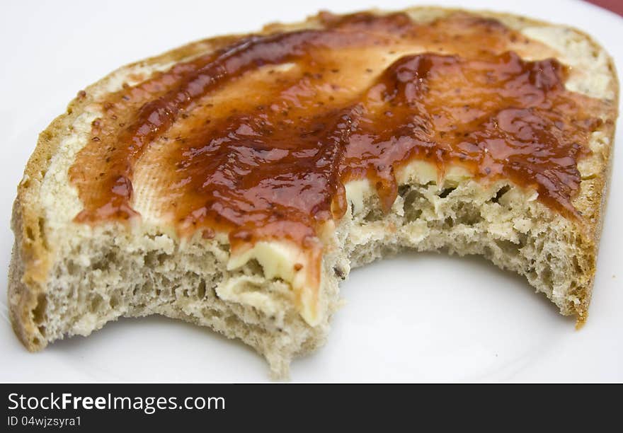 Delicious slice of bread with butter and strawberry jam. Delicious slice of bread with butter and strawberry jam