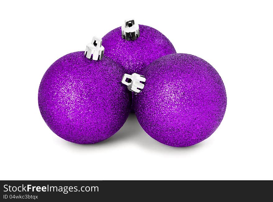 Three pink baubles for christmas firtree on white background