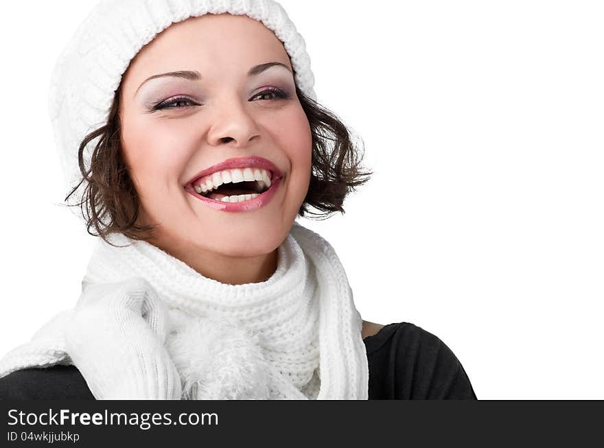 Beautiful young girl in her winter warm clothing on white background