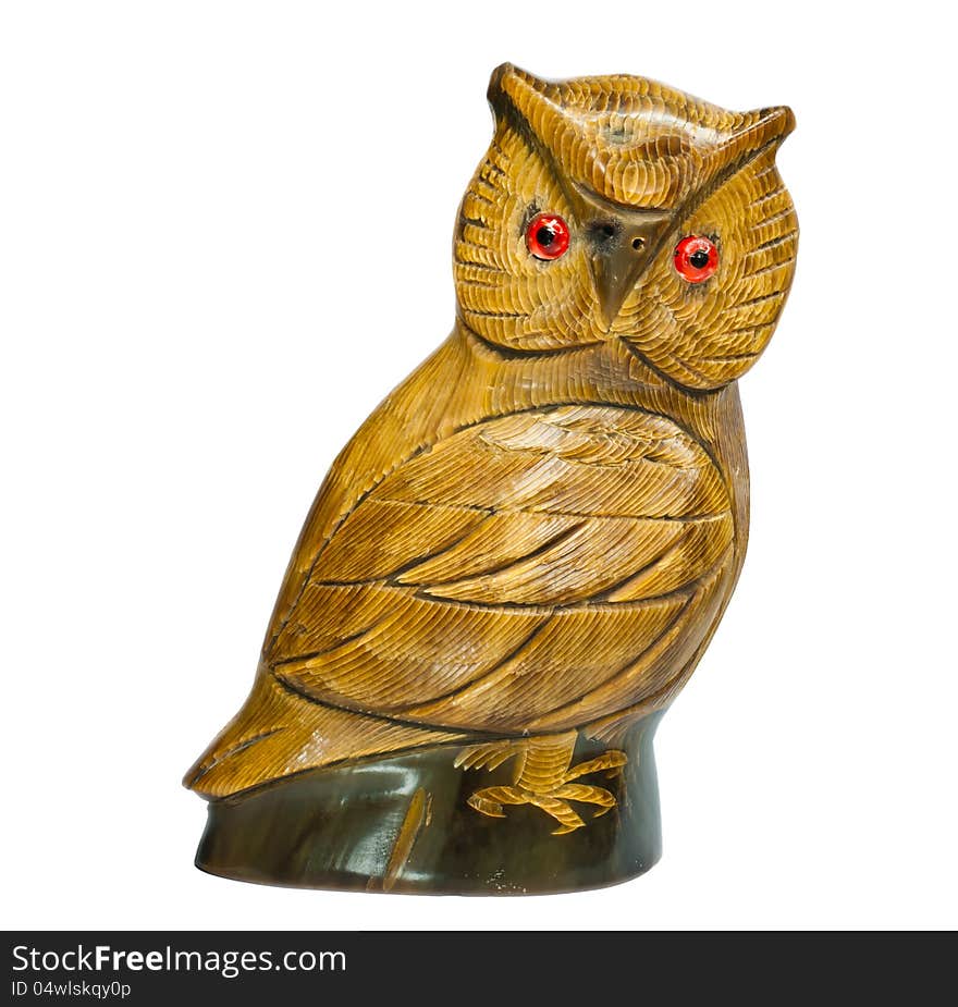 Wooden owl carved on a white background