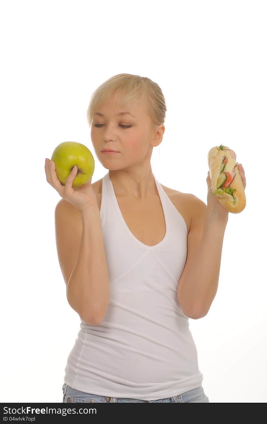 Slim Woman Choosing Between Apple And Hamburger