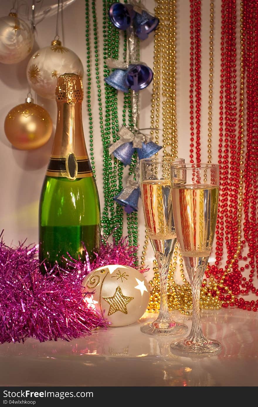 New Year decorations with two glasses and bottle o