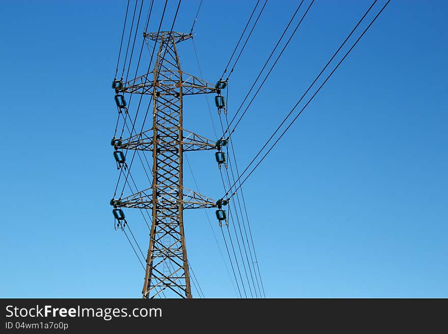 High voltage electric power lines on blue sky