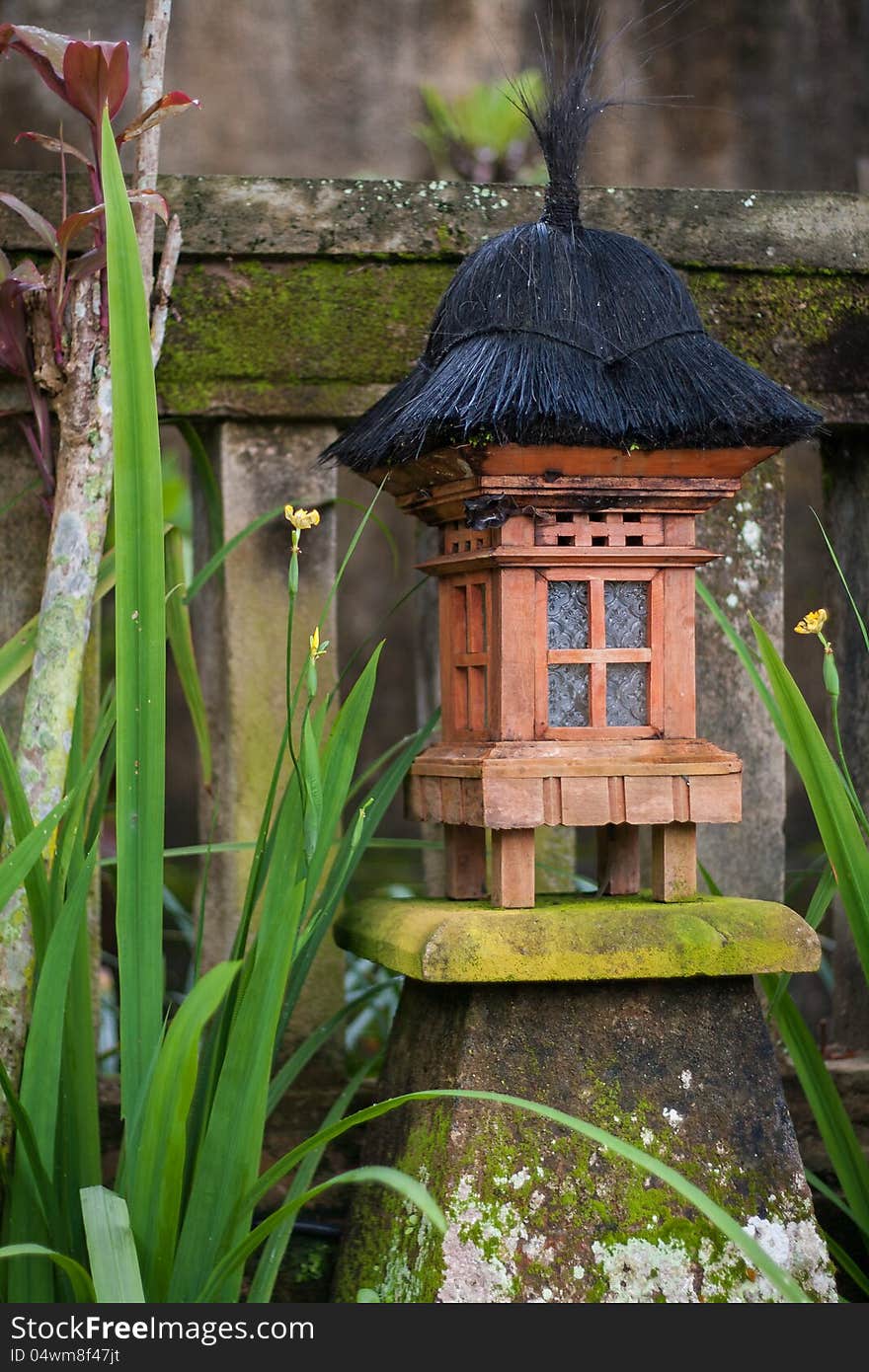 Wooden lantern on a concrete base