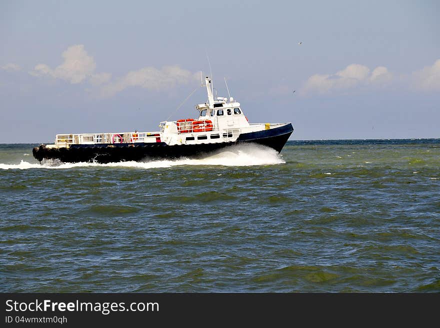 Oil rig or platform supply boat on way to offshore station.