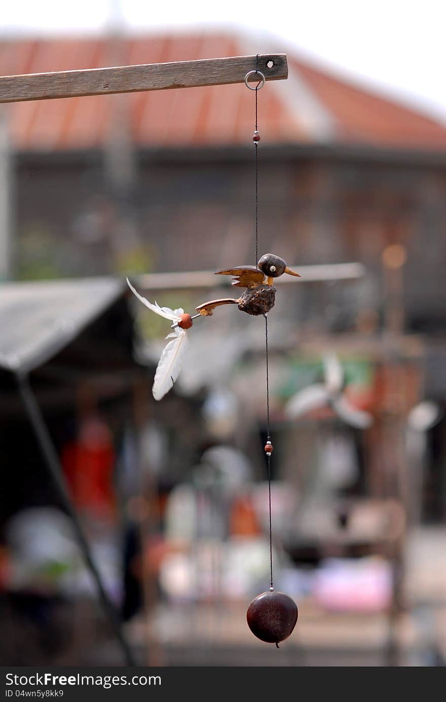 Bird vane mobile. Handmade from coconut, dried fruit and feathers.