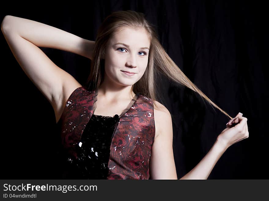 A beautiful woman against a black background