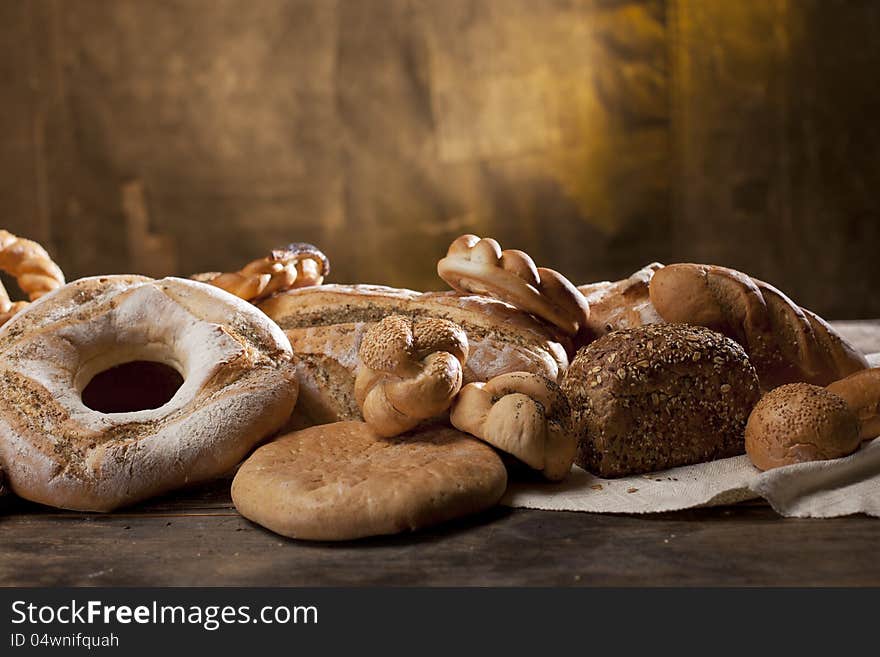 Studio arrangement with baked products on wood table. Studio arrangement with baked products on wood table