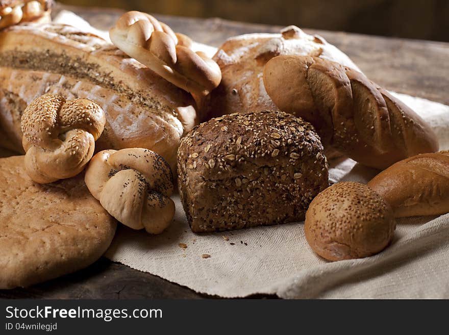 Studio arrangement with baked products on wood table. Studio arrangement with baked products on wood table