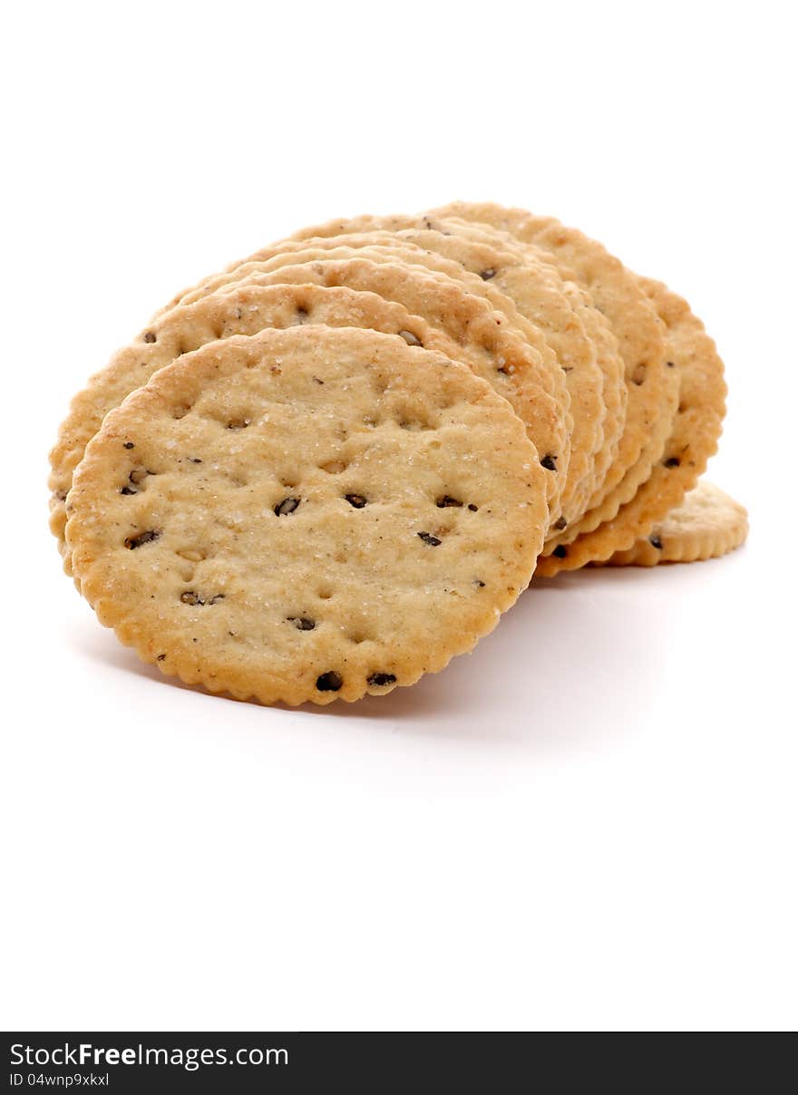 Dry Biscuits with Seeds in a Row closeup on white background