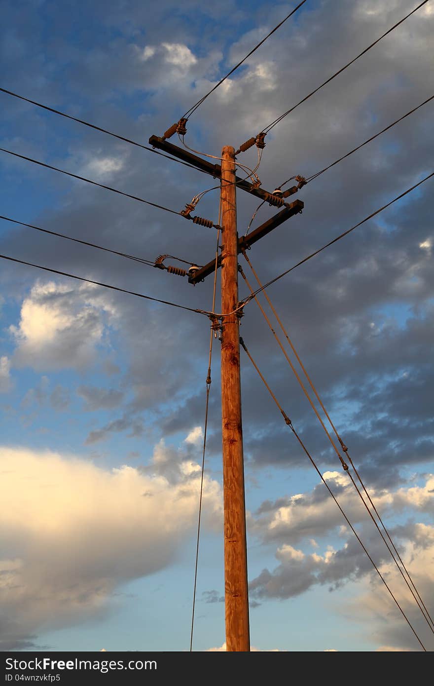 Electrical utility pole with electrical lines. Electrical utility pole with electrical lines.