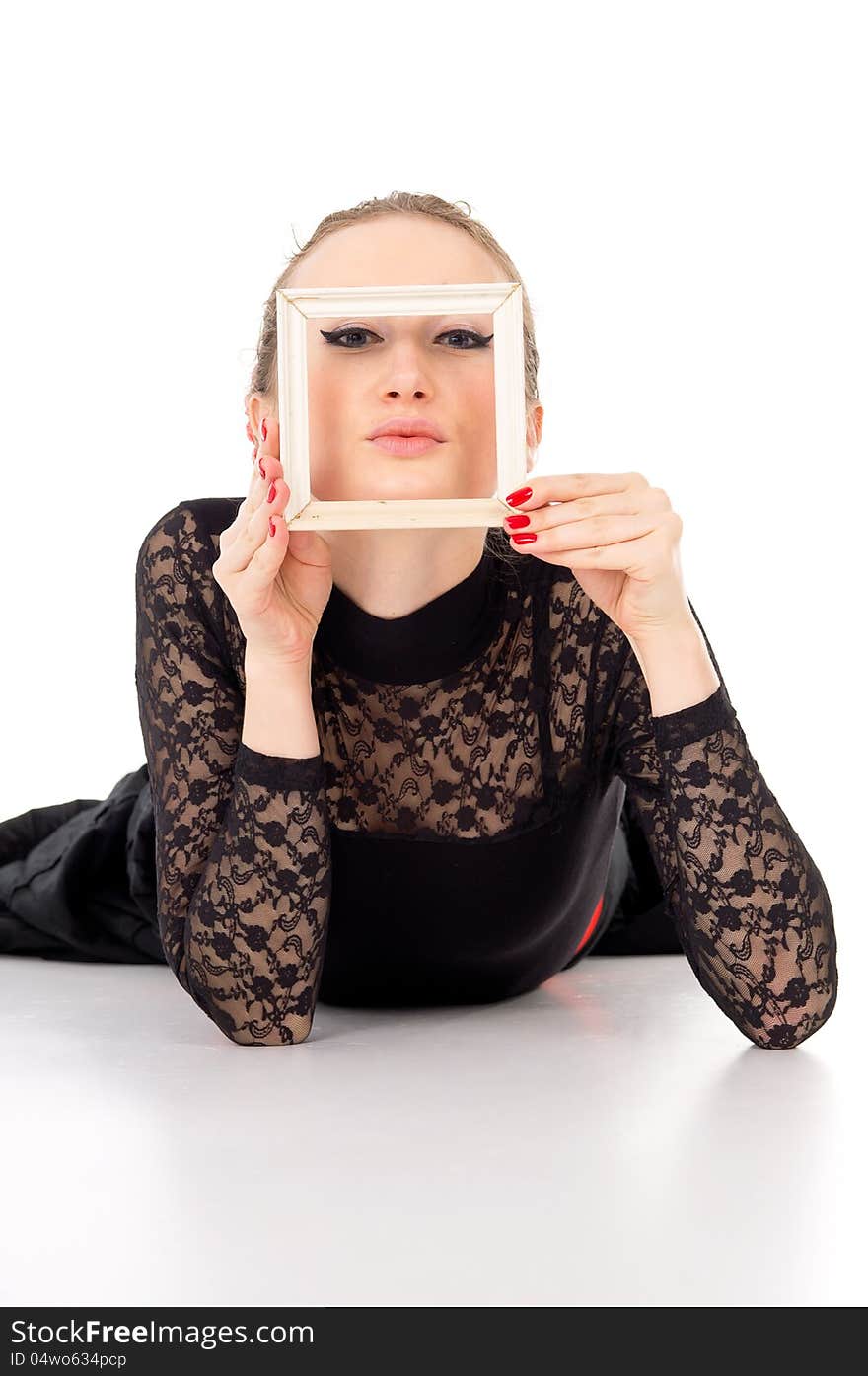 Beautiful girl holding a picture frame isolated on white background