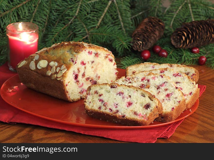 Sliced loaf of cranberry bread on a platter