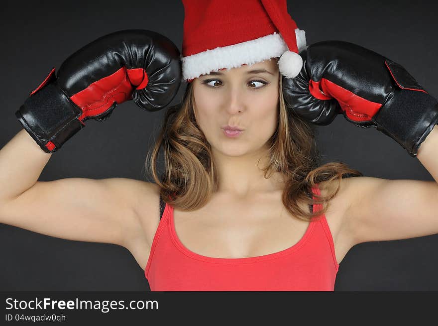 Santa girl  wearing boxing gloves