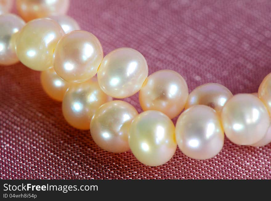 Pink pearls closed-up.