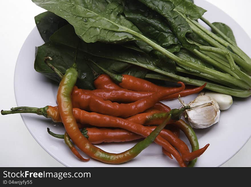 Green spinach and red chili. Green spinach and red chili