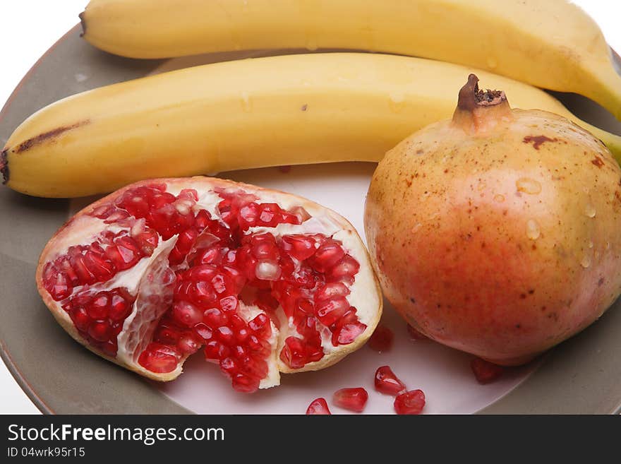 Yellow bananas and red pomegranate
. Yellow bananas and red pomegranate