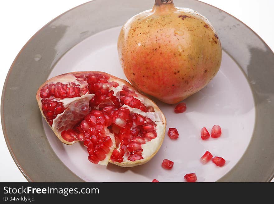 Yellow bananas and red pomegranate. Yellow bananas and red pomegranate