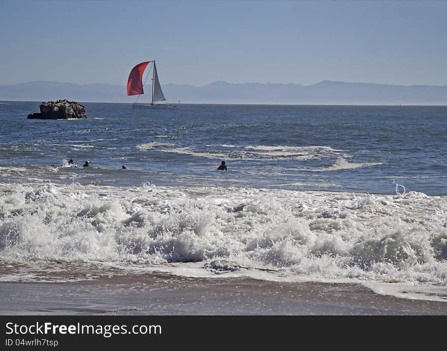 Surfers wating for wave in Pacific Ocean