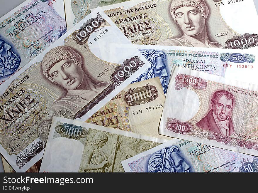 THESSALONIKI, GREECE - AUG 23: Old greek drachma cash notes on August 23, 2012 in Thessaloniki,Greece. THESSALONIKI, GREECE - AUG 23: Old greek drachma cash notes on August 23, 2012 in Thessaloniki,Greece.