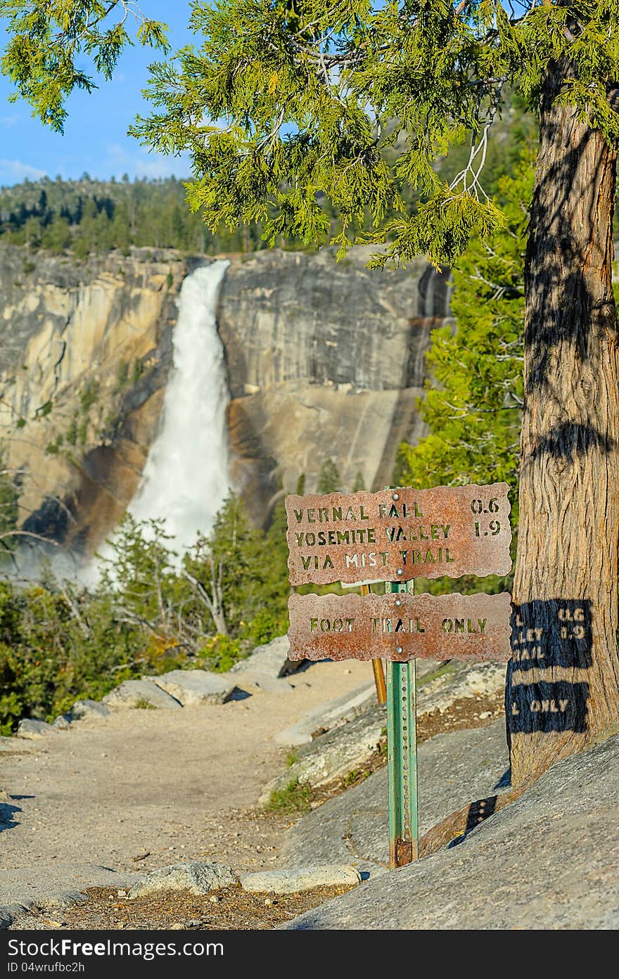 Tourist sign and waterfall in Yosemite