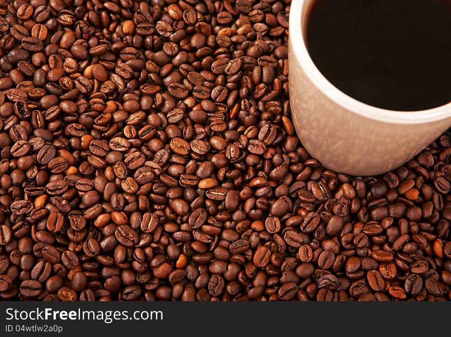 Cup of coffe with coffee beans on a white background. Cup of coffe with coffee beans on a white background