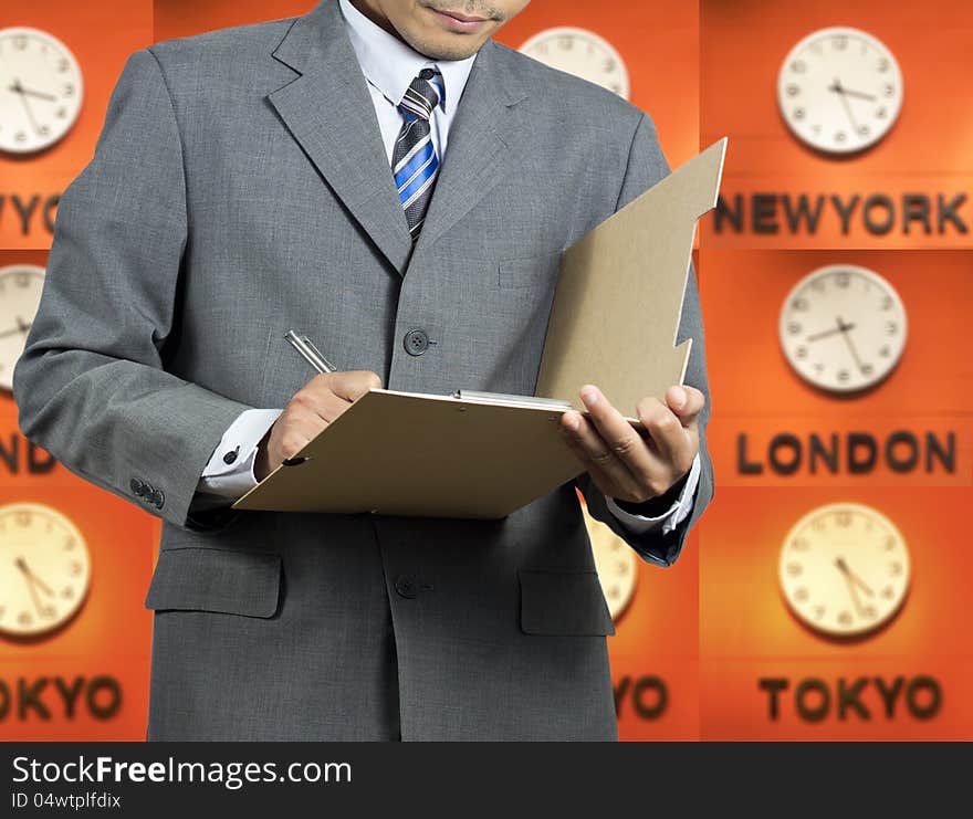 Businessman signing document and time