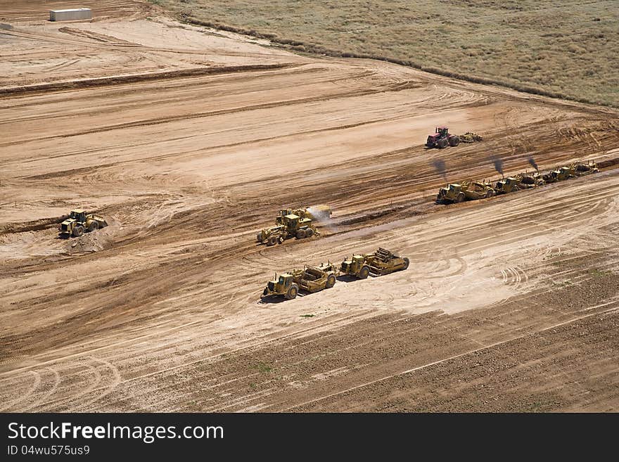 Grading of landfill with heavy equipment from above