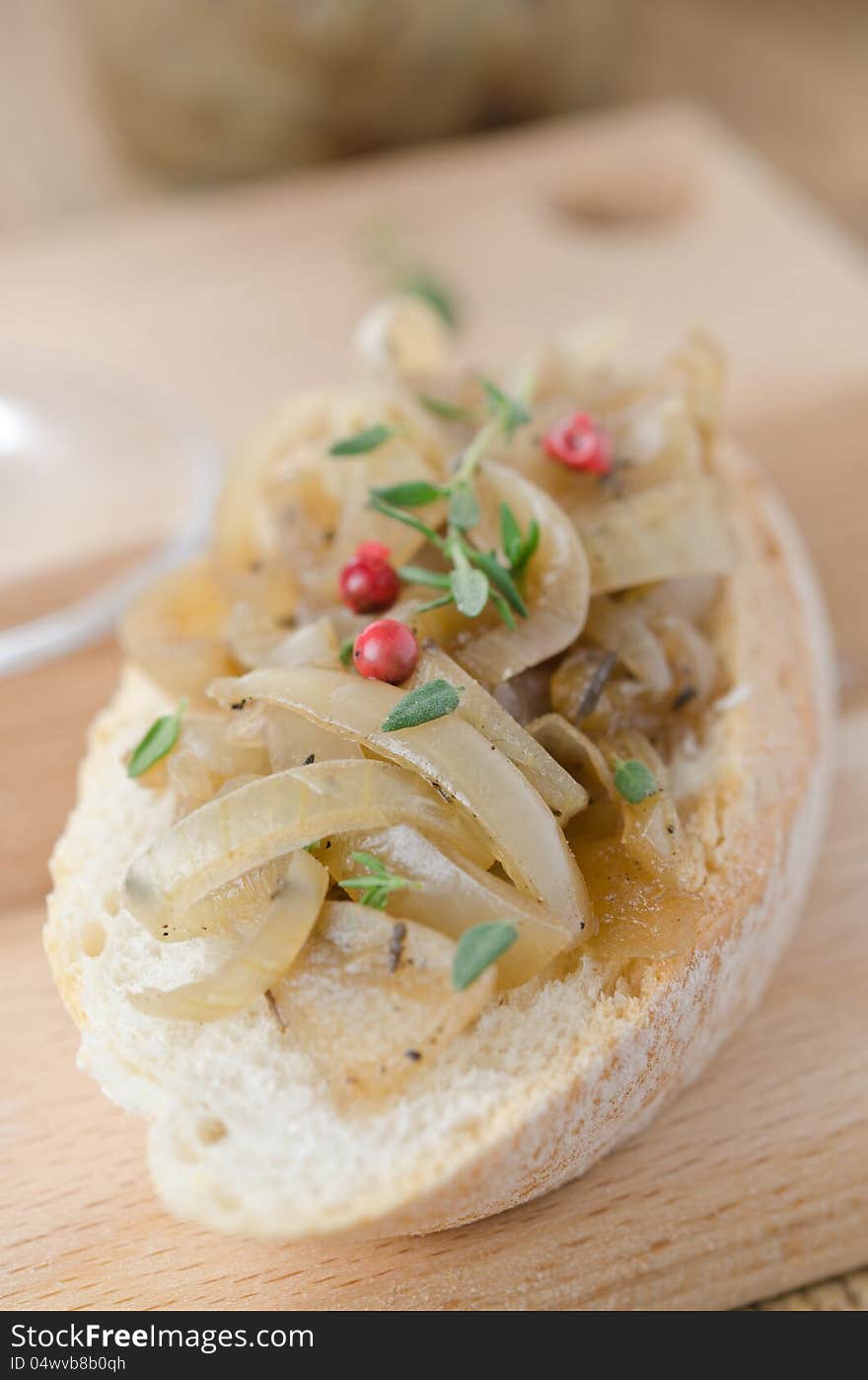 Confit Of Shallots On A Piece Of Baguette