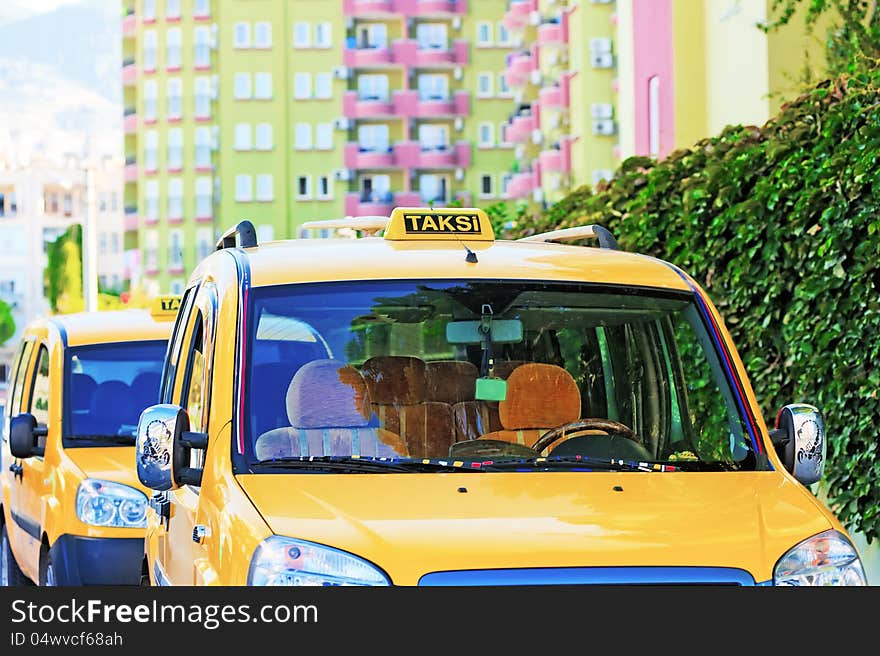 Two Turkish taxi stand waiting for a client. Two Turkish taxi stand waiting for a client